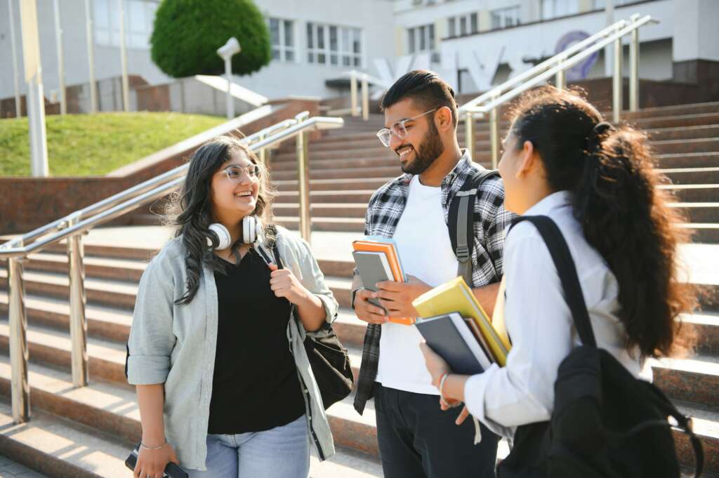 Cheerful Indian asian young group of college students or friends together